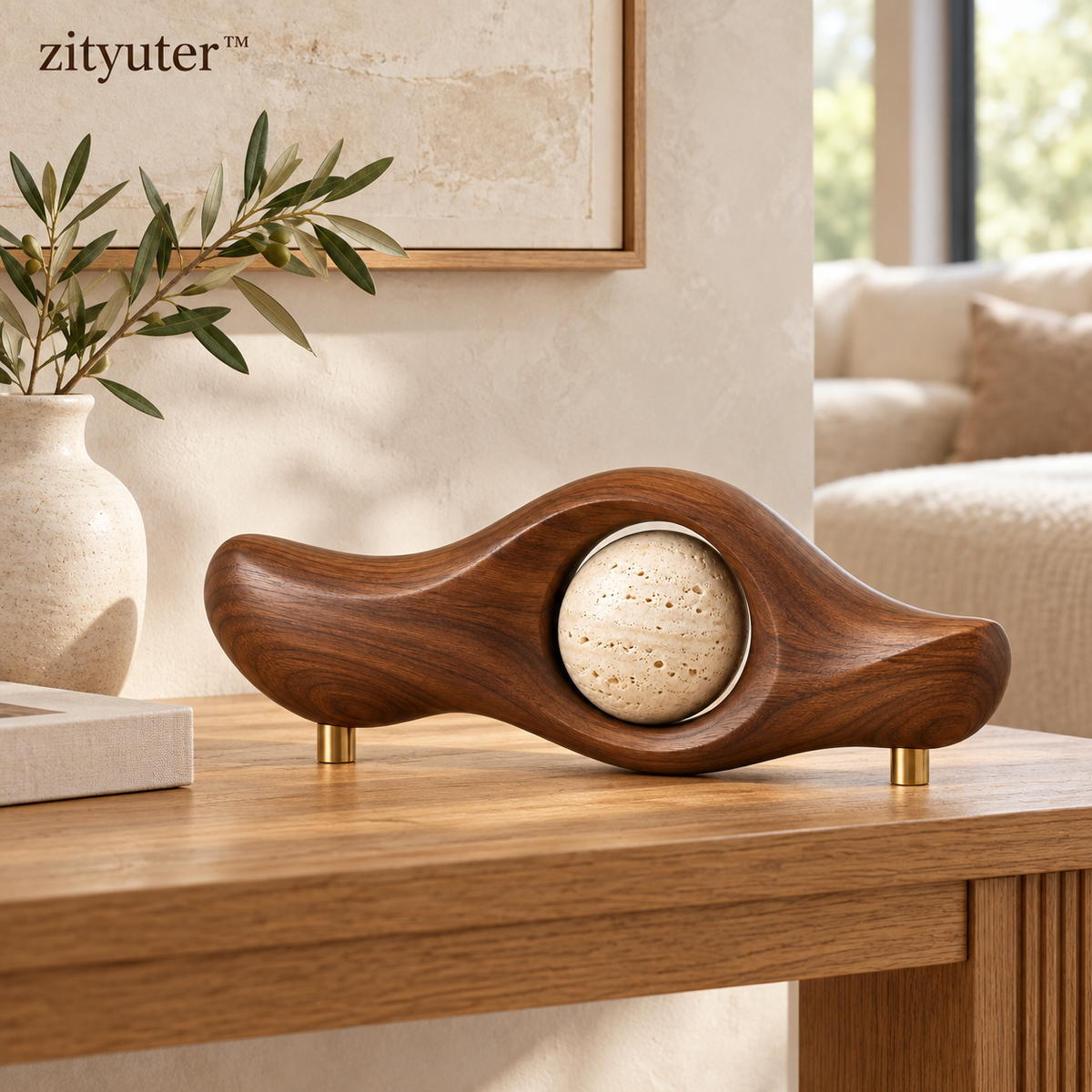 Walnut wave and travertine orb sculpture styled on a modern console